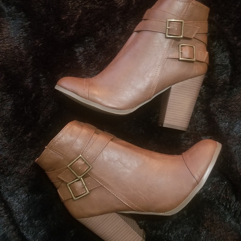Brown heeled booties.